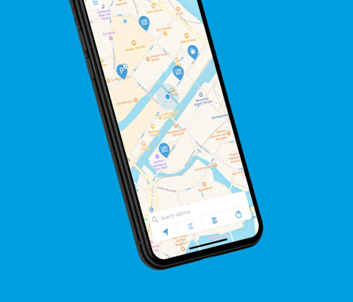 Share Now map view on iPhone showing car2go vehicle pins near a river