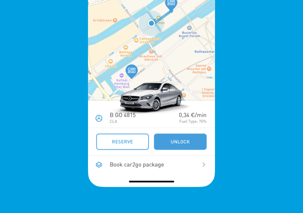 car2go vehicle detail screen showing a Mercedes CLA with Reserve and Unlock CTAs and a book-package option